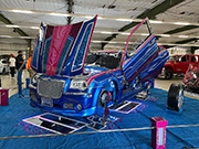 A fancy show car on display in the theater building