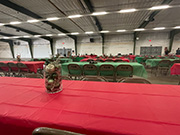 The theater building interior with tables covered in red table cloths for a company party