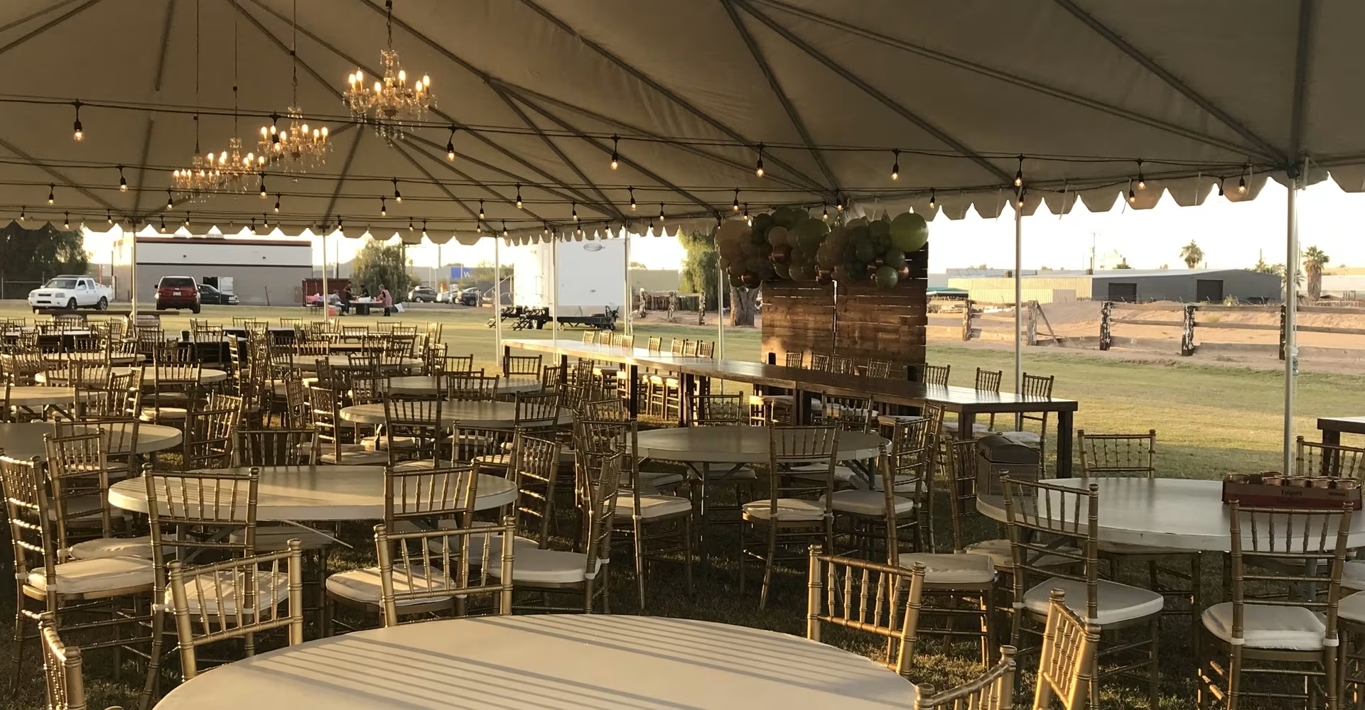 A large event tent with tables in it ready to host something at the grounds