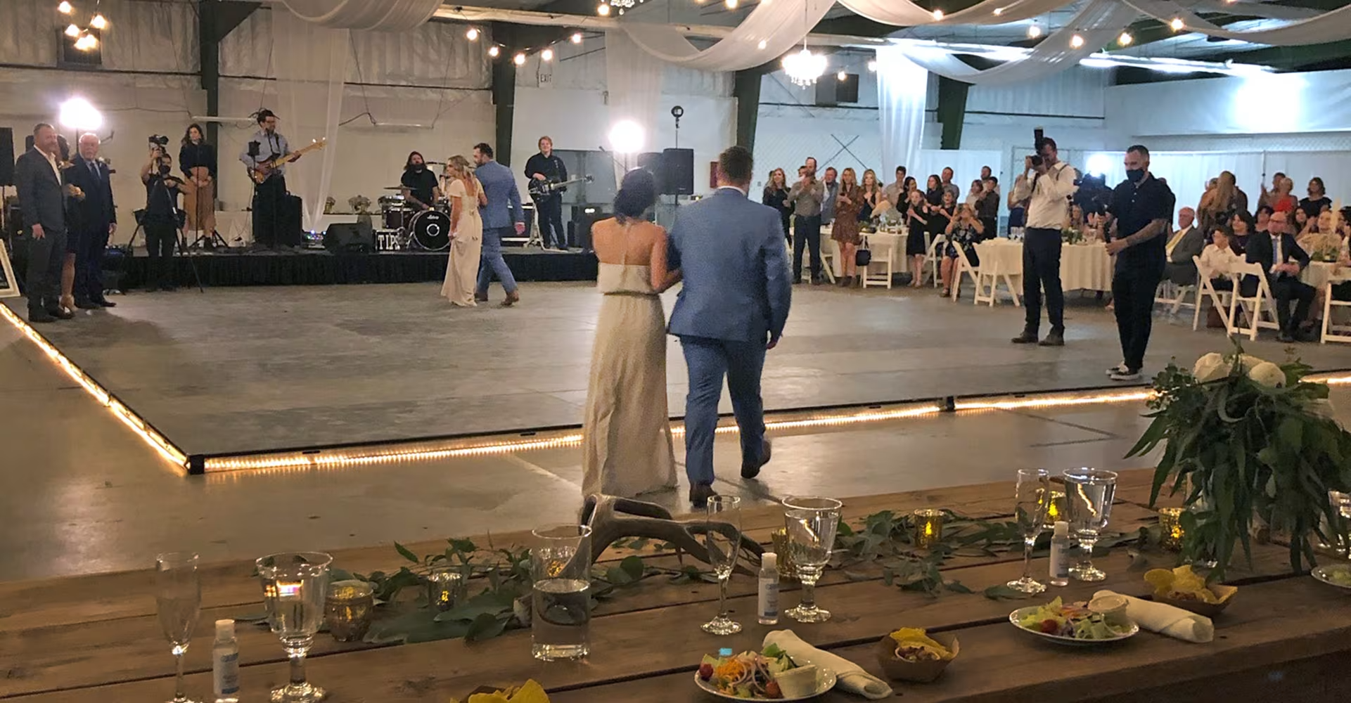 Couples dancing at an event in the theater building